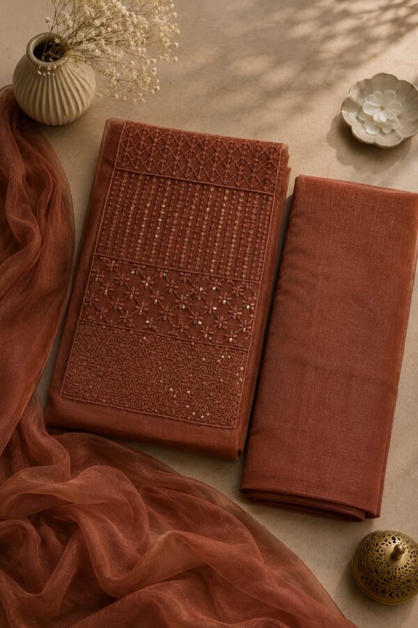 MJ209 (1) Bronze Unstitched Dress Material for Women with embroidered net top, rayon bottom and matching net dupatta
