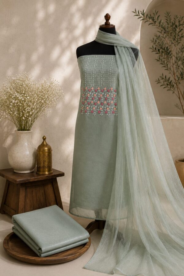 MJ212 (2) Mint Green Unstitched Dress Material for Women with floral embroidered net top, silk blend bottom and matching net dupatta