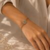 Spiral Crystal Charm Bracelet for Women with sparkling crystal accents and adjustable gold-tone design