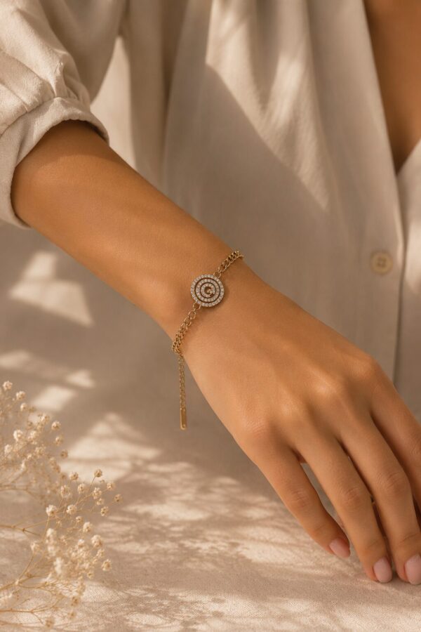 Spiral Crystal Charm Bracelet for Women with sparkling crystal accents and adjustable gold-tone design