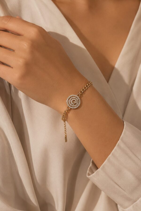 Spiral Crystal Charm Bracelet for Women with sparkling crystal accents and adjustable gold-tone design